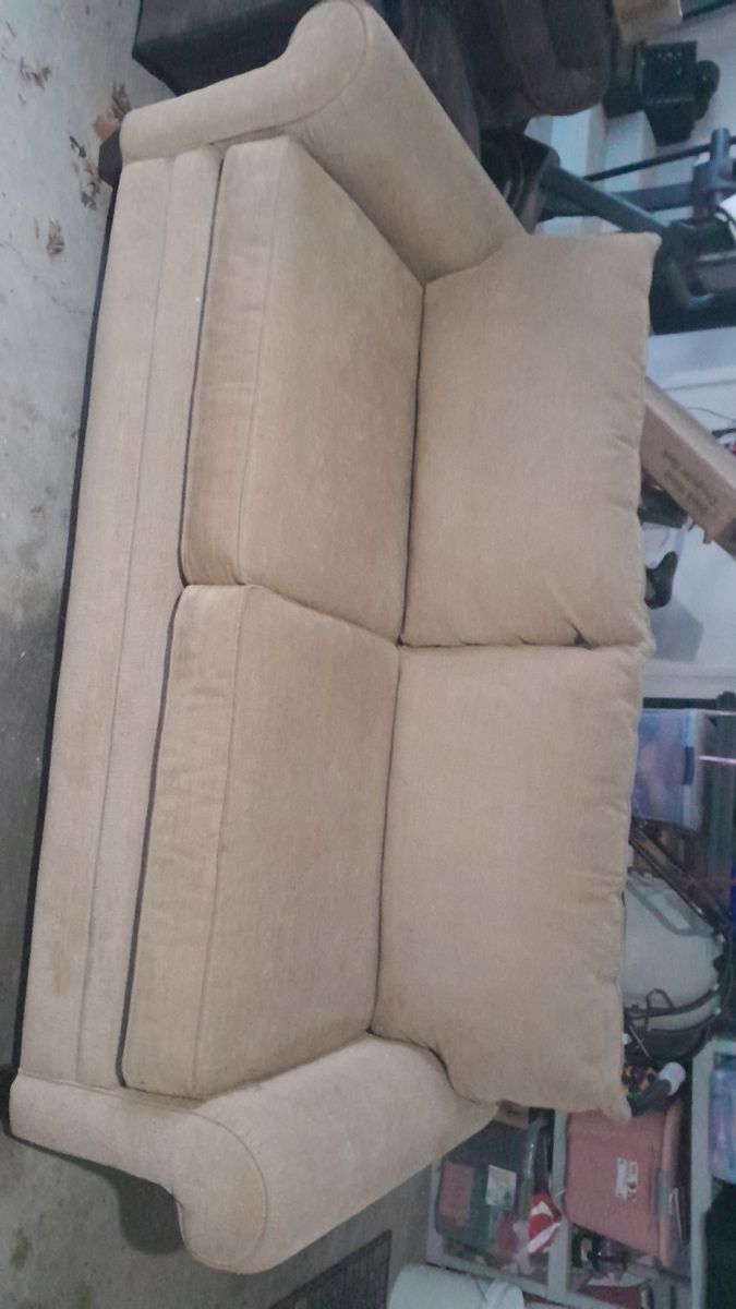 Free tan couch with two pillows in good shape just got a tear from moving no linger need got a new set