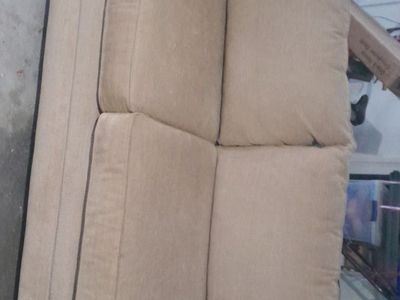 Free tan couch with two pillows in good shape just got a tear from moving no linger need got a new set