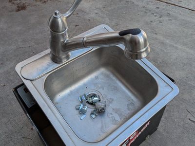 Small Stainless Sink with Delta Pull-Out Faucet