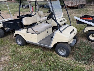 Club Car DS Golf Cart - Beige, 2-seater with rear cargo bed, older model