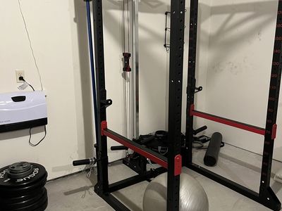 Power Cage w/ Lat Pulldown & Low Row + Rogue Ohio Bar (Cerakote, 20 kg / 45 lb) & Rogue Echo Bumper 230 lb Set — $975