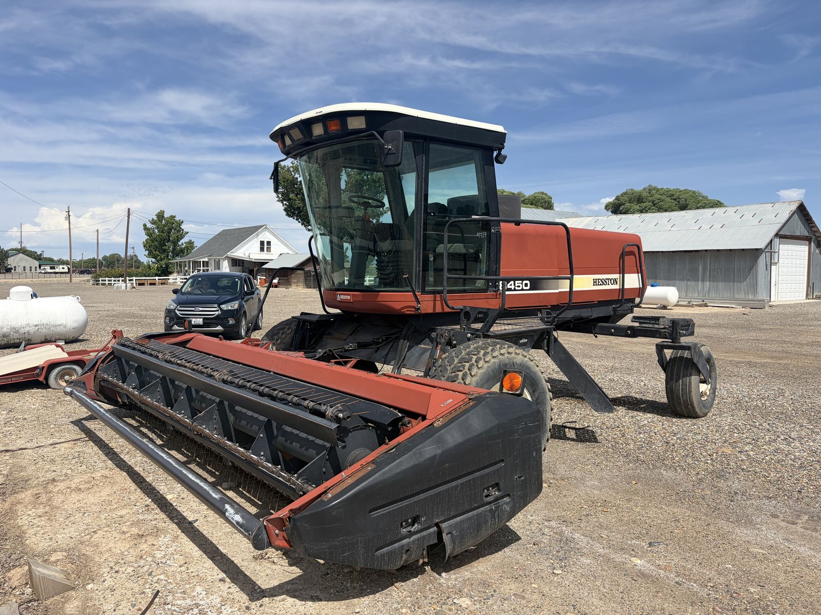 Hesston 8450 Self-Propelled Swather with 8020 16' Hay Header