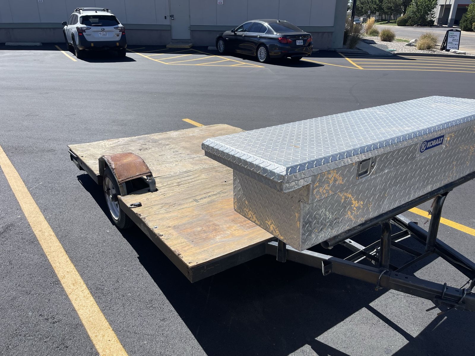 Small trailer with tool box reall light easy to pull and low to ground for easy loading 