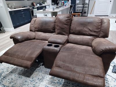 Brown rocker recliner couch