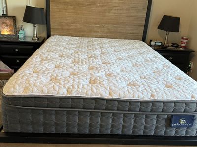 Queen sized headboard and base with two drawers.
