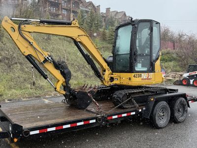 Cat 304, 40 Class Mini Excavator for Rent! Dump Trailer or Flatbed Trailer Combos available. Thumb and Blade
