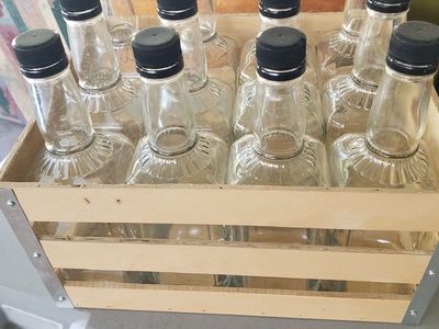hand crafted create with whiskey bottles