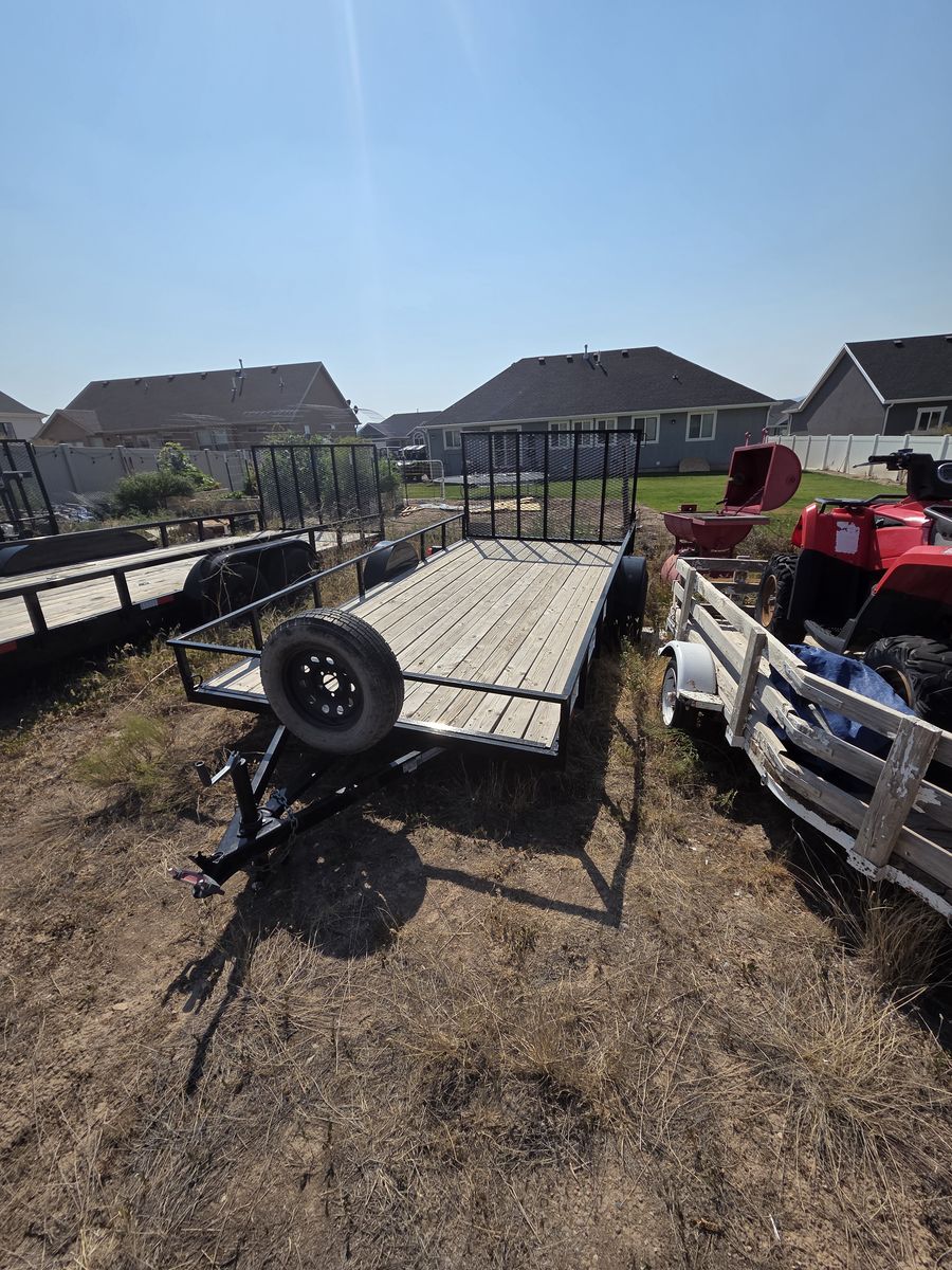 2021 7'x14' single axle utility trailer with spare tire.