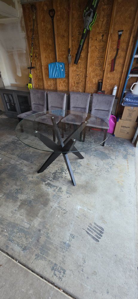 Glass dinner table with 4 chairs