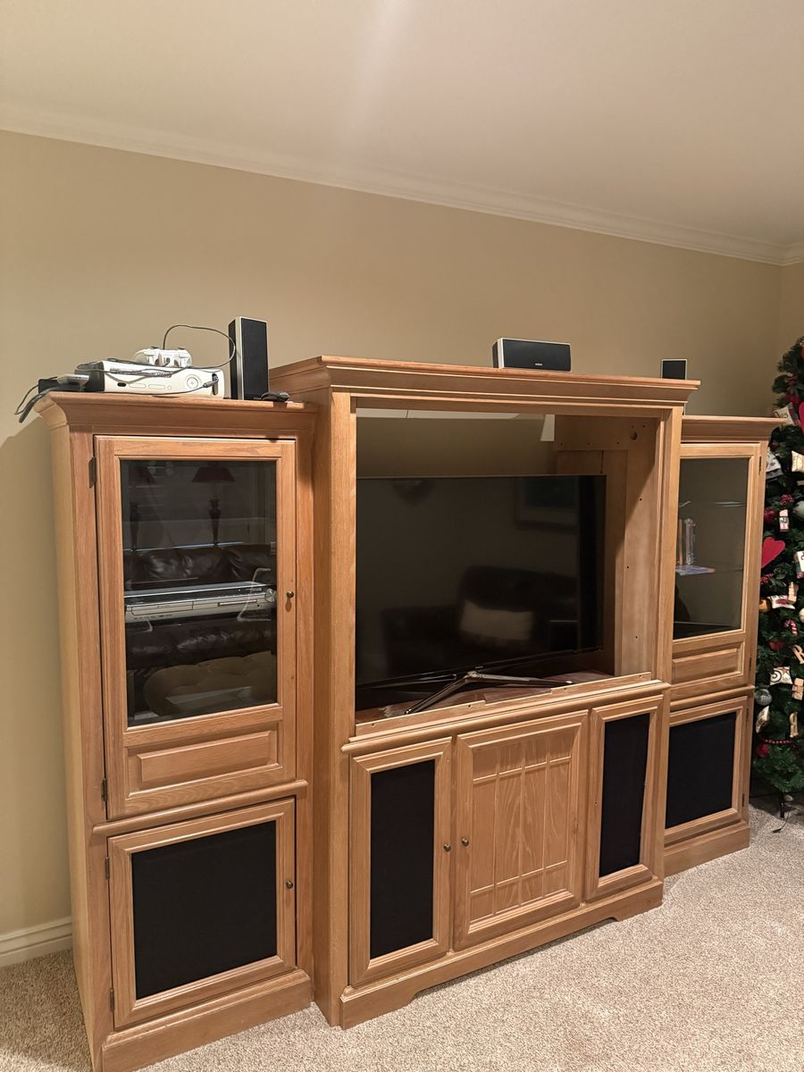 Large Wooden Entertainment Center with Glass Doors and Storage