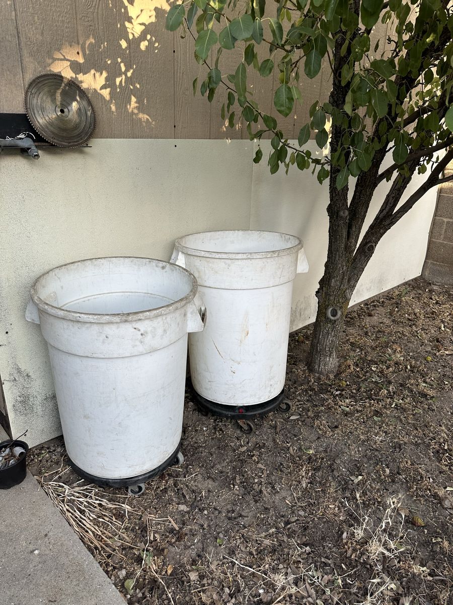 2 White Plastic Garbage Cans with Rolling Dollies - Good Condition, Handles