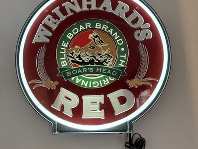 Vintage red glass neon sign. Motorized rotating center wheel