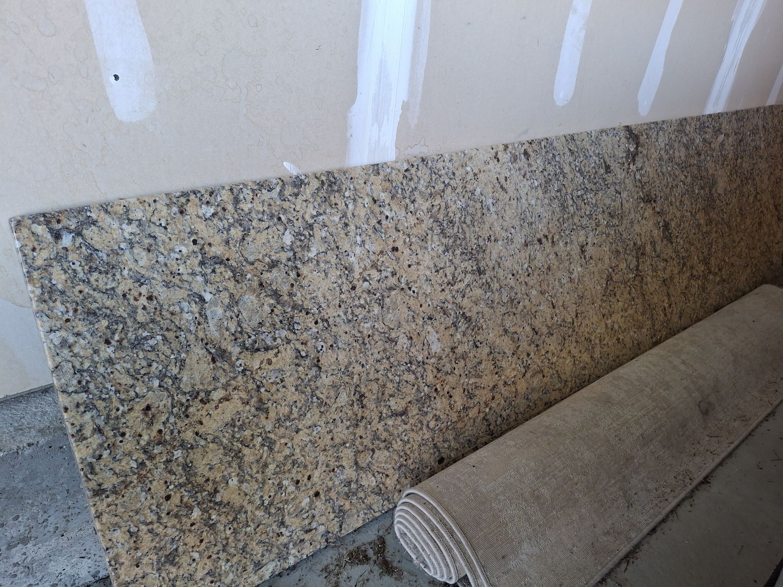 Granite countertop with pieces of backsplash