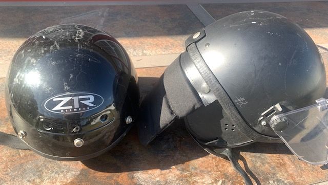 2 motorcycle helmets