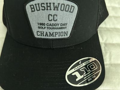 Travis Matthew’s Bushwood CC 1980 Caddy Day Golf Tournament Champion Flexfit 110 Trucker Hat