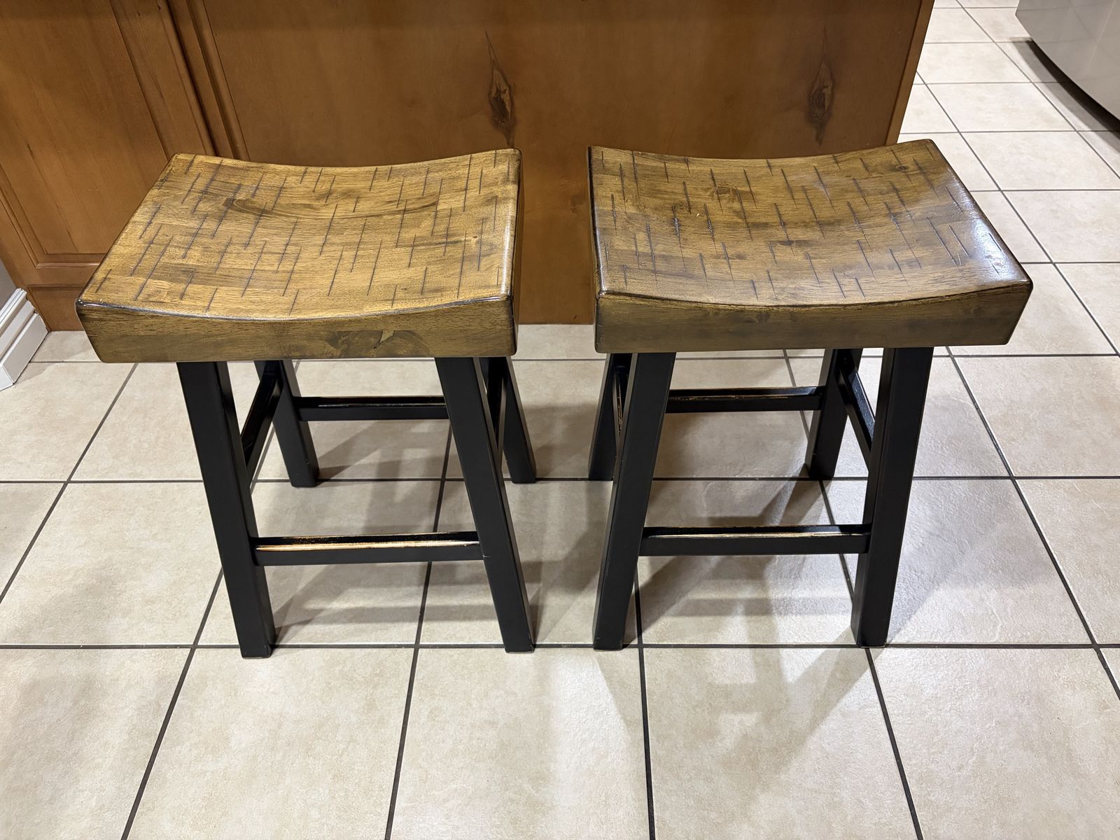 Pair of Wooden Saddle Seat Bar Stools, Counter Height, Black Wooden Legs