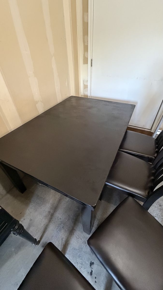 Black wood table with chairs