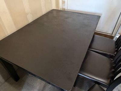Black wood table with chairs