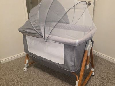 Gray, Mesh Netting, Adjustable Height bassinet.