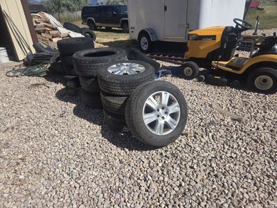 Set of 235 60 16" Tires on Subaru Alloys. LIKE NEW