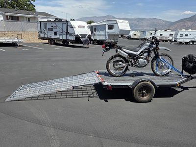 Like new Black Widow Aluminum Loading Ramp - 1500 lbs Capacity, Folding for loading ATV/Motorcycle/small UTV. Safety straps incl