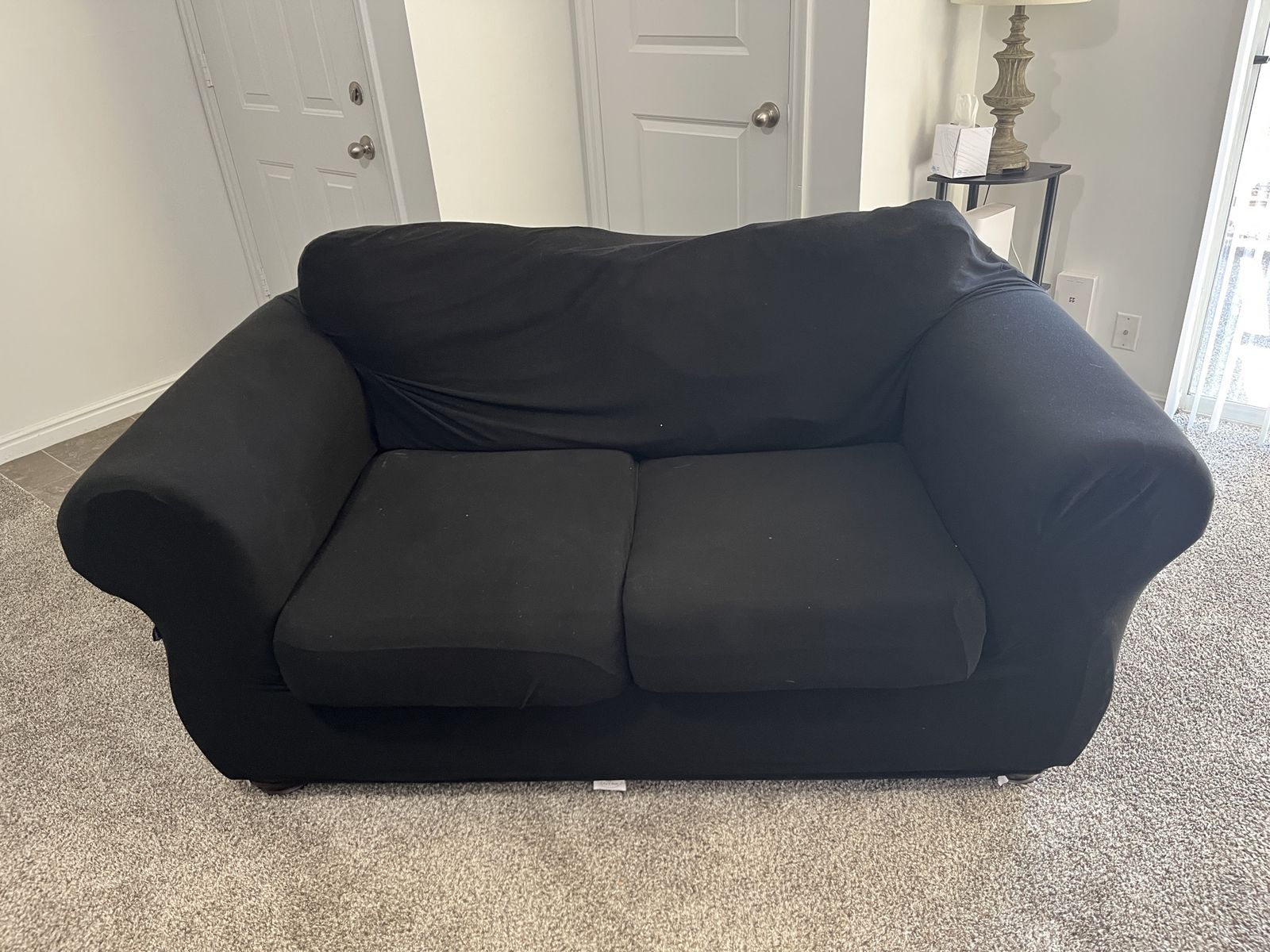 Used Brown Loveseat with Black Stretch Cover