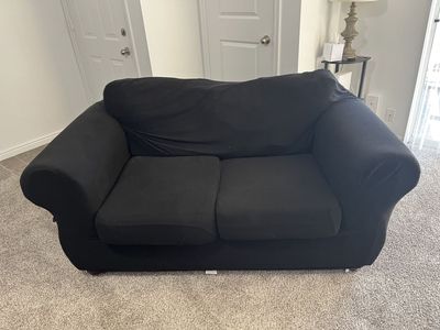 Used Brown Loveseat with Black Stretch Cover