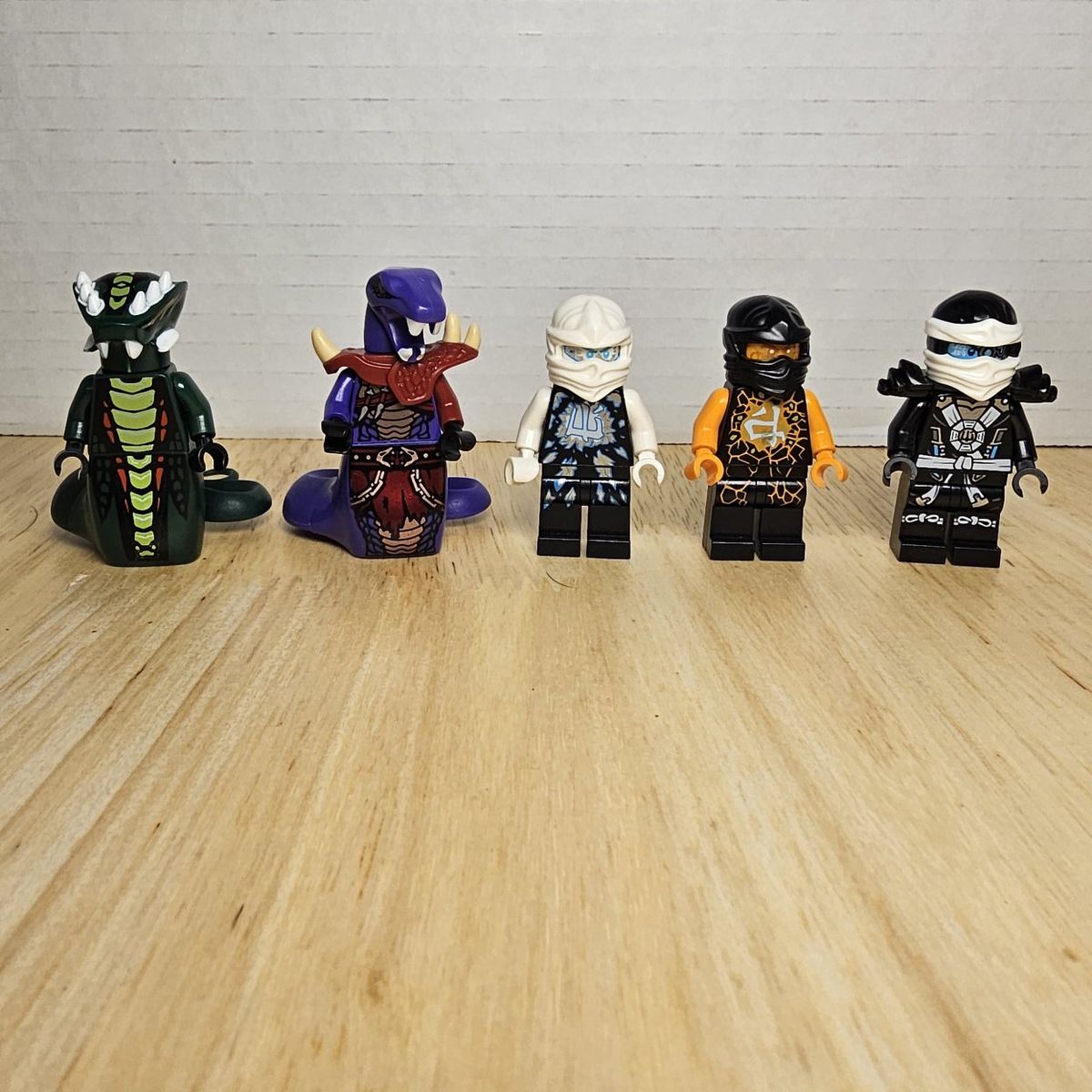 Five NINJAGO LEGO Minifigures