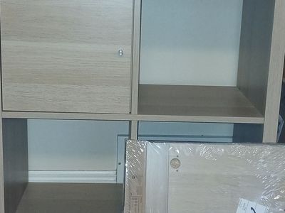 IKEA KALLAX Shelf Unit with Door Insert - Light Wood Finish, 2x2 Cube Storage