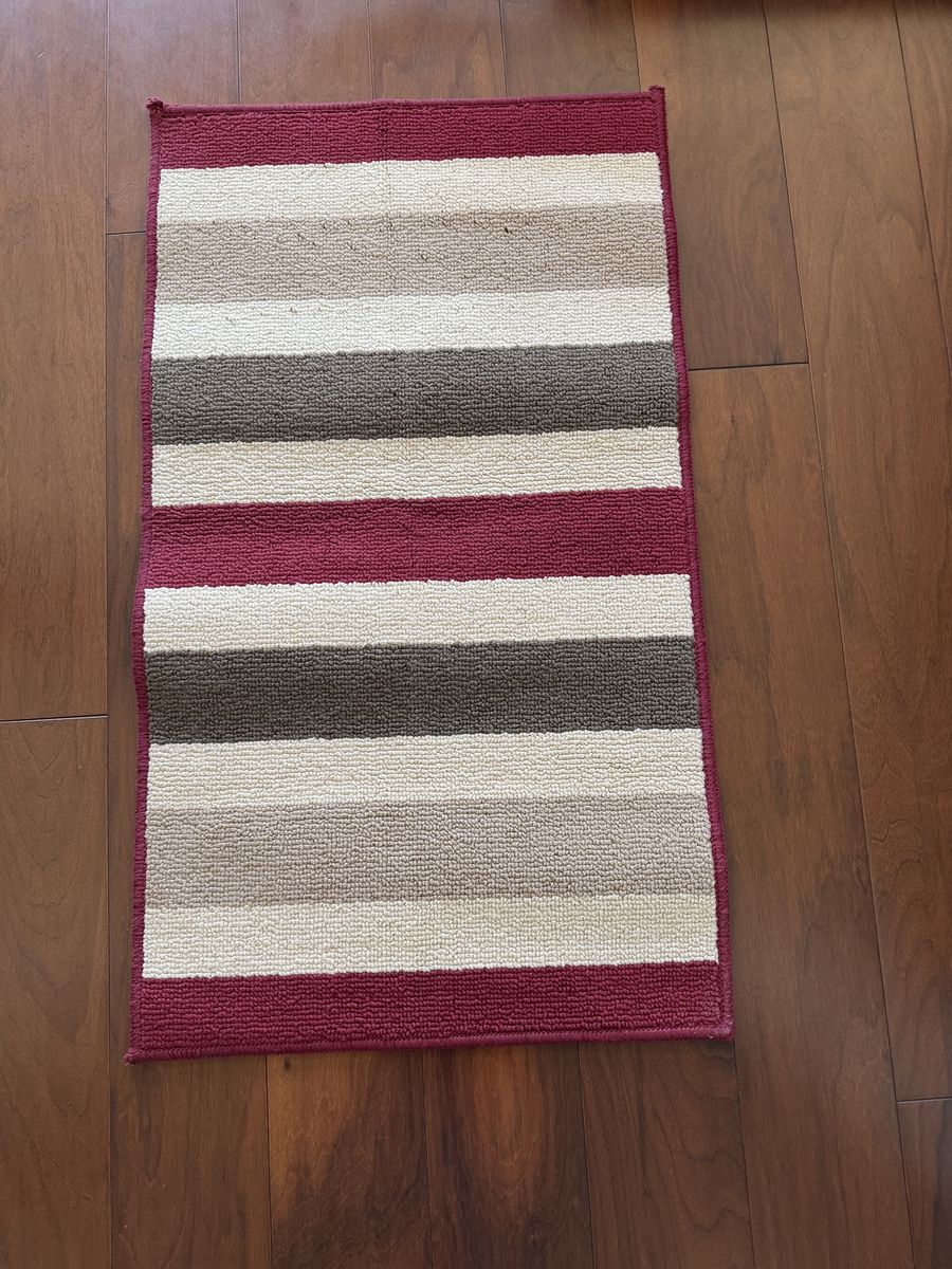 New rug with rubber back 19”x33”