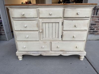Distressed Wooden Dresser with Multiple Drawers and Cabinet