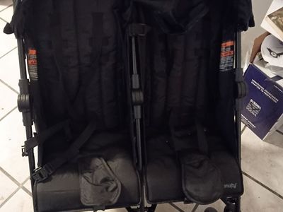 Side by side black double stroller