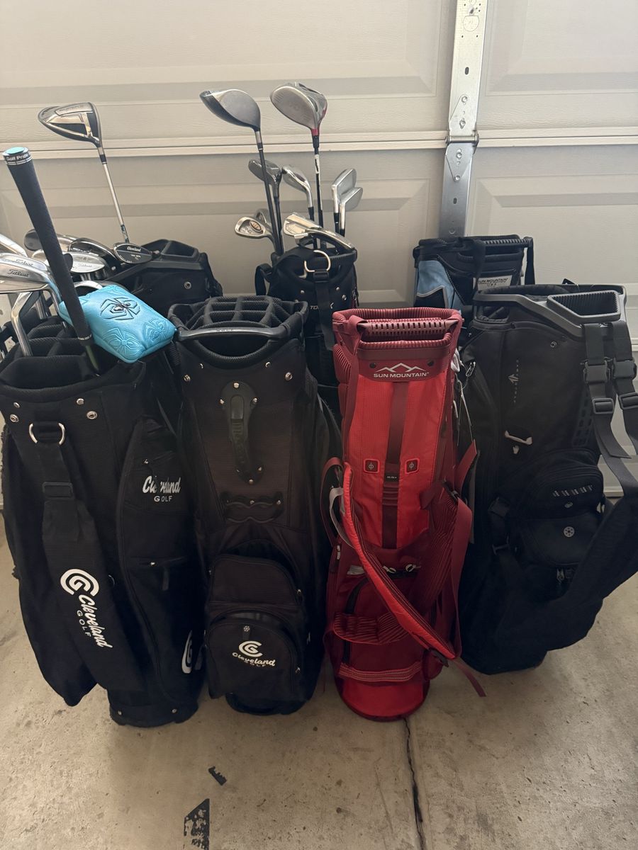 Large lot of golf clubs