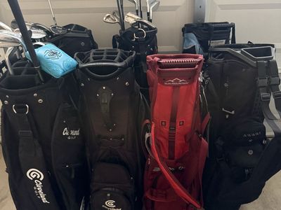 Large lot of golf clubs