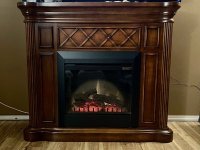 ELECTRIC FIREPLACE WITH WOOD MANTEL - $60 (STEAL!)