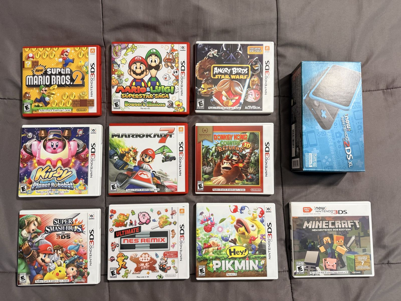Nintendo 2DS XL Black and Turquoise and 3DS Game Bundle