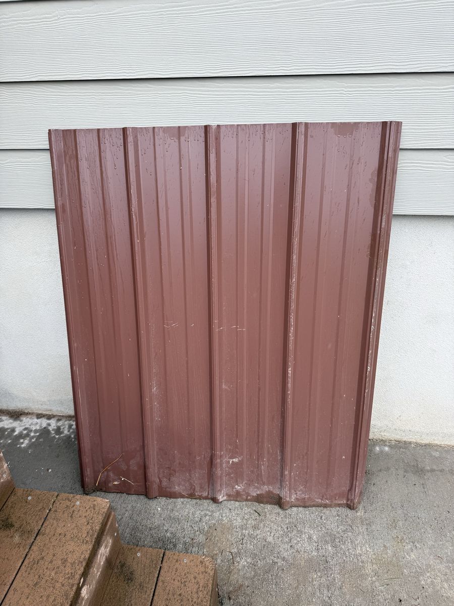 3 sheets of brown corrugated tin