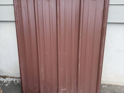 3 sheets of brown corrugated tin