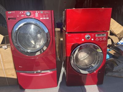 Maytag washing machine and LG electric dryer with pedestals.