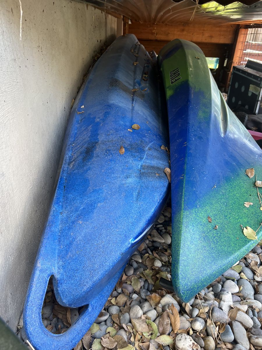 2 kayaks and small boat