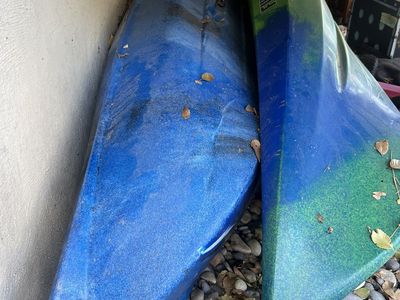 2 kayaks and small boat