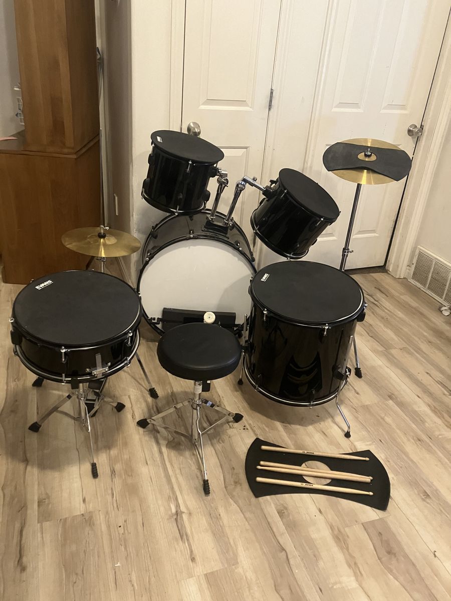Adult drum set with mute pads