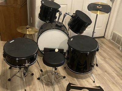 Adult drum set with mute pads
