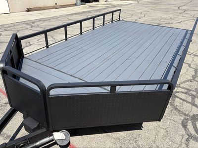 8’ x 14’ + 2’V nose Flatbed Trailer, side rails, fold-down rear rail, ramp stowed under deck.