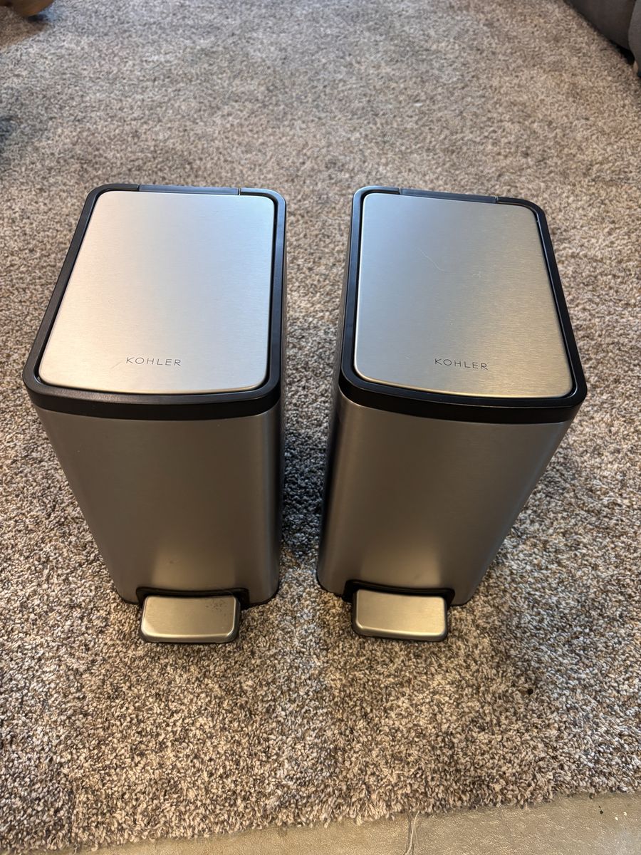 Two Kohler trash cans