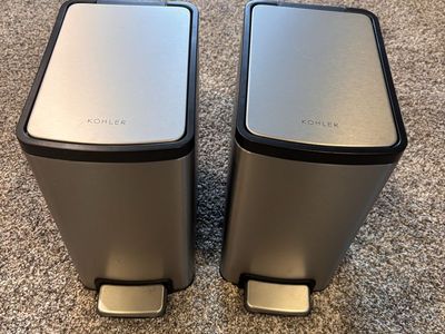 Two Kohler trash cans