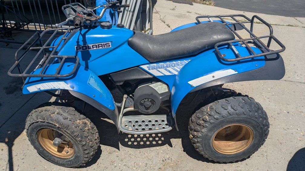 2 Polaris 250ES Trailboss 4 wheelers 2x4  2 stroke engines both ran, comes with new belts and carb kits, as is, bring a trailer!