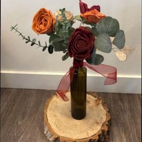 Wood flower arrangement in amber bud vase