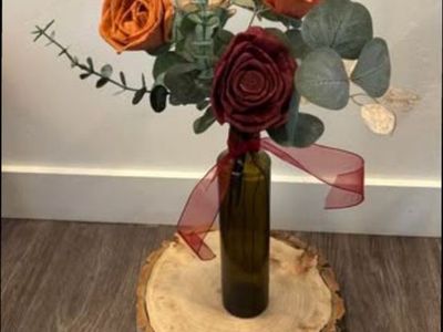 Wood flower arrangement in amber bud vase