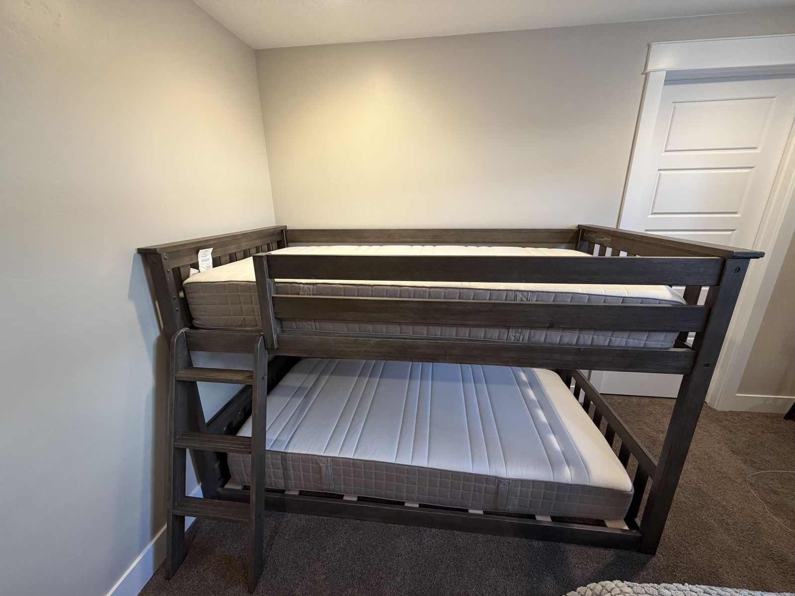 Twin size bunk beds with new unused mattresses
